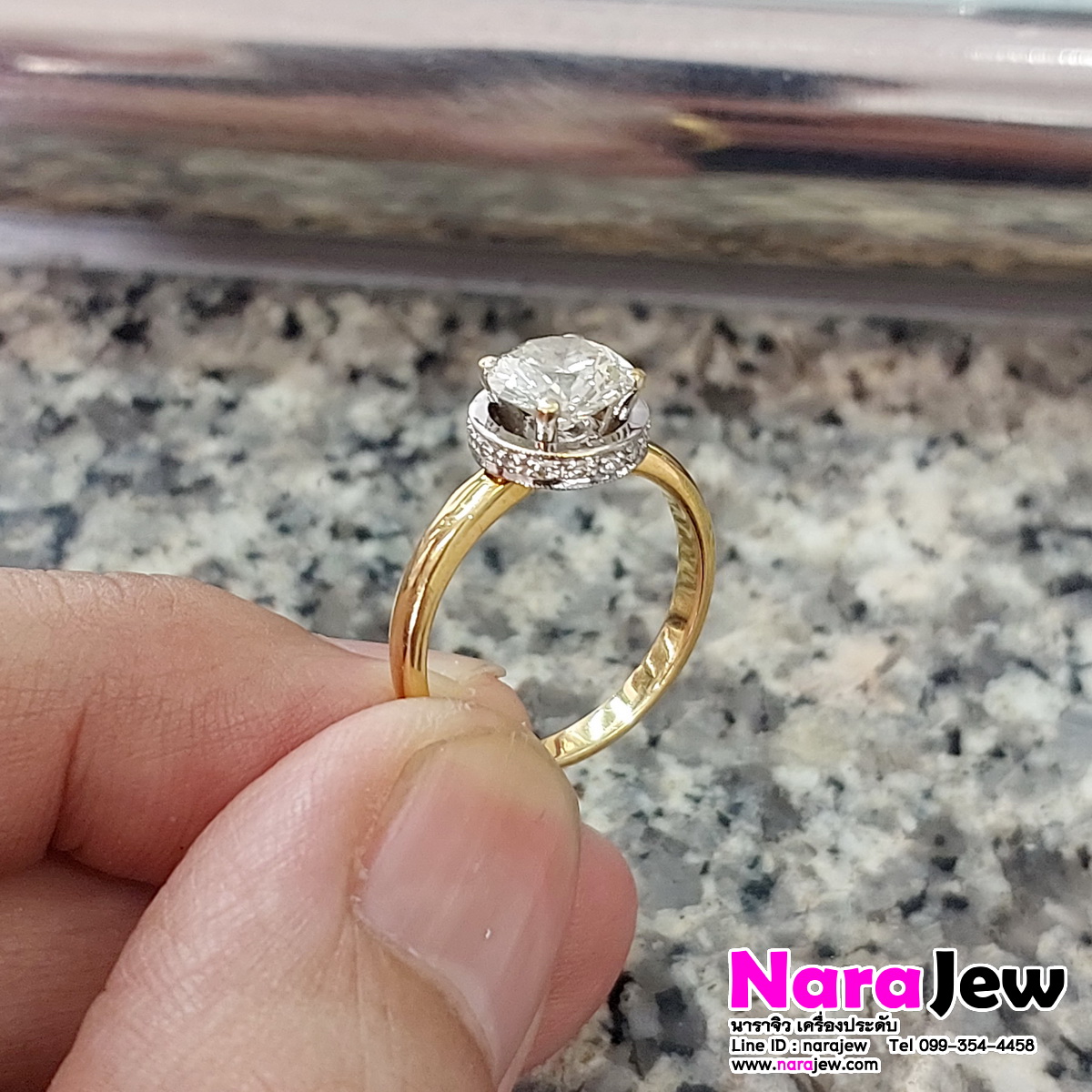 แหวนเพชร เม็ดชู นน. 1.5 กะรัต ล้อมเพชร 0.36 กะรัต น้ำ 92 vs