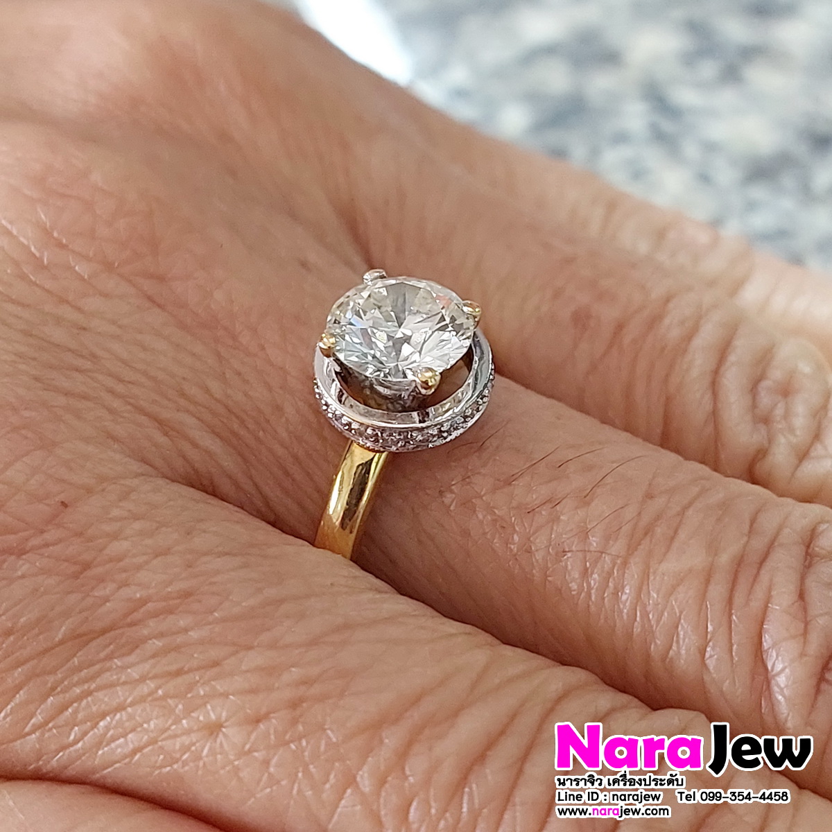 แหวนเพชร เม็ดชู นน. 1.5 กะรัต ล้อมเพชร 0.36 กะรัต น้ำ 92 vs
