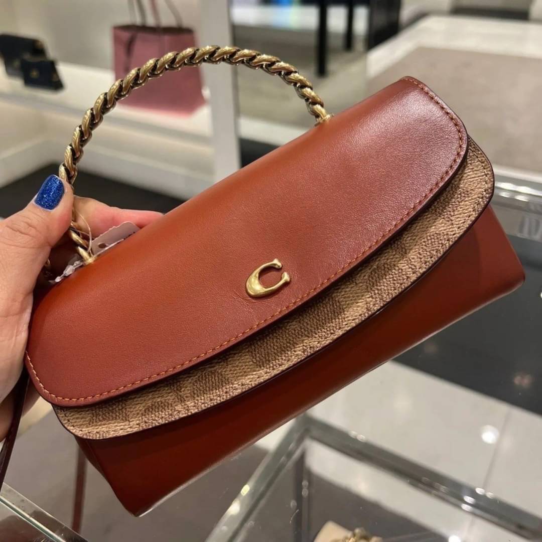 Coach Clutch In Signature Canvas